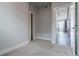 Bedroom featuring neutral carpet and access to other rooms at 2350 Tremont Pl # 19, Denver, CO 80205