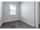 Neutral bedroom with carpet, a window looking out onto a neighborhood, and a closet at 2350 Tremont Pl # 19, Denver, CO 80205