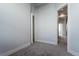 Bedroom with neutral carpet, white trim and doors, and stairway access at 2350 Tremont Pl # 19, Denver, CO 80205