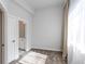 Bedroom with light carpet, ensuite bath and bright window at 2350 Tremont Pl # 19, Denver, CO 80205