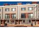 Modern townhome featuring a contemporary design with multi-tone siding and private balconies at 2350 Tremont Pl # 19, Denver, CO 80205