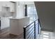Open kitchen with modern white cabinets, stainless steel appliances, and quartz countertops at 2350 Tremont Pl # 19, Denver, CO 80205