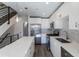 Open floor plan with modern kitchen, stainless steel appliances, and quartz countertops at 2350 Tremont Pl # 19, Denver, CO 80205