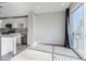 Bright living area with modern kitchen and sliding glass door to a balcony at 2350 Tremont Pl # 19, Denver, CO 80205