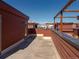 Enjoy outdoor urban living on this expansive rooftop patio featuring brown wood finishes and city views at 2350 Tremont Pl # 19, Denver, CO 80205