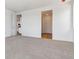 Bright bedroom with neutral carpet and entrances to other rooms of the home at 19060 E 96Th Pl, Commerce City, CO 80022