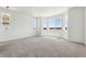 Light-filled bedroom with large windows and neutral carpet at 19060 E 96Th Pl, Commerce City, CO 80022