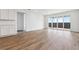 Bright living room with wood flooring and large sliding glass doors provide natural light at 19060 E 96Th Pl, Commerce City, CO 80022