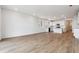 Spacious living room with an open floor plan and kitchen area with stainless steel appliances at 19060 E 96Th Pl, Commerce City, CO 80022