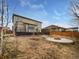 Inviting backyard with a deck, pergola, and fire pit, perfect for outdoor gatherings and relaxation at 8236 E 137Th Dr, Thornton, CO 80602