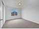 Neutral bedroom with new carpet, white walls, and a large window at 8236 E 137Th Dr, Thornton, CO 80602