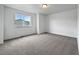 Neutral bedroom features clean, white walls and plush carpeting, awaiting personal touches at 8236 E 137Th Dr, Thornton, CO 80602