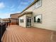 Spacious composite deck off the main level with black metal railings and stairs to the backyard at 8236 E 137Th Dr, Thornton, CO 80602