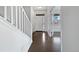 Bright entryway with hardwood floors, neutral walls, and stairs leading to the upper level at 8236 E 137Th Dr, Thornton, CO 80602