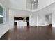 Spacious living room with hardwood floors, an open floor plan, and lots of natural light at 8236 E 137Th Dr, Thornton, CO 80602