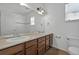 Bathroom featuring double sinks, modern fixtures, and natural light at 16043 Bridle Ridge Dr, Monument, CO 80132