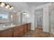 Spacious bathroom with dual sinks, large vanity, and glass enclosed shower providing ample storage and functionality at 16043 Bridle Ridge Dr, Monument, CO 80132