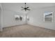Large bedroom features a vaulted ceiling, ceiling fan, and multiple windows for natural light and an open floor plan at 16043 Bridle Ridge Dr, Monument, CO 80132