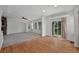 Large living room with hardwood floors, a fireplace, and access to a patio via a sliding glass door at 16043 Bridle Ridge Dr, Monument, CO 80132