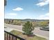 Scenic street view featuring a tree-lined road and distant mountain views at 16043 Bridle Ridge Dr, Monument, CO 80132