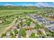 Beautiful aerial view of the home in a quiet neighborhood with picturesque mountain views and lush green surroundings at 8427 S Parfet Ct, Littleton, CO 80127