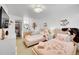 Charming bedroom features two beds, a window, and soft lighting at 8427 S Parfet Ct, Littleton, CO 80127