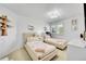 Charming bedroom features two beds, a window, and soft lighting at 8427 S Parfet Ct, Littleton, CO 80127