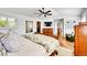 Comfortable bedroom with ceiling fan and a view of the hallway at 8427 S Parfet Ct, Littleton, CO 80127