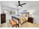 Well-lit bedroom includes a ceiling fan and cozy decor at 8427 S Parfet Ct, Littleton, CO 80127