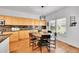 Dining area features hardwood floors, natural light, and built in cabinets at 8427 S Parfet Ct, Littleton, CO 80127