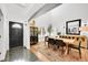 Stylish dining room features modern decor and seamless access to the entryway at 8427 S Parfet Ct, Littleton, CO 80127