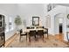 Elegant dining room offers a modern light fixture, bright natural light, and stylish decor at 8427 S Parfet Ct, Littleton, CO 80127
