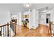Upstairs hallway features an office nook and hardwood floors throughout at 8427 S Parfet Ct, Littleton, CO 80127