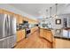 Spacious kitchen features granite countertops, stainless steel appliances, and an eat-in island at 8427 S Parfet Ct, Littleton, CO 80127