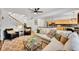 Open-concept living room with a comfortable seating area and seamless access to the kitchen at 8427 S Parfet Ct, Littleton, CO 80127