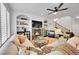 Cozy living room features a fireplace with a marble surround, built-in shelving, and comfortable seating at 8427 S Parfet Ct, Littleton, CO 80127