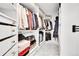 A well-organized walk-in closet with shelving, drawers, and hanging space at 8427 S Parfet Ct, Littleton, CO 80127
