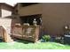 Inviting back deck with lounge seating, lush landscaping, and a quiet escape at 283 Yank Ct, Lakewood, CO 80228