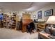 Finished basement with a cozy desk area, bookshelves, and neutral carpet, perfect for a home office at 283 Yank Ct, Lakewood, CO 80228