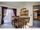 Cozy dining area featuring a wooden table, chairs, and natural light from a window at 283 Yank Ct, Lakewood, CO 80228