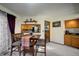 Charming dining area featuring a wooden table, chairs, and natural lighting at 283 Yank Ct, Lakewood, CO 80228