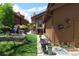 Brown home with an inviting walkway, flowerpots, attractive landscaping, and curb appeal at 283 Yank Ct, Lakewood, CO 80228