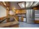 Bright kitchen with stainless steel appliances and tiled backsplash at 283 Yank Ct, Lakewood, CO 80228