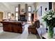 Bright living room with large windows, a brick fireplace, and cozy seating at 283 Yank Ct, Lakewood, CO 80228