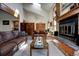 Inviting living room featuring a fireplace, skylights, and comfortable seating arrangement at 283 Yank Ct, Lakewood, CO 80228