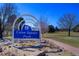 Union Square Park sign surrounded by a landscaped area with a walking path and green space in the background under a sunny sky at 283 Yank Ct, Lakewood, CO 80228