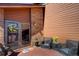 Charming patio with wicker chairs, flower accents, and a welcoming entrance at 283 Yank Ct, Lakewood, CO 80228