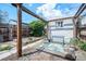 Backyard featuring a wood pergola with bench, a green mat, and a detached building at 4467 W 30Th Ave, Denver, CO 80212