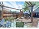 Backyard with a wood pergola, wood fence, and mat with seating at 4467 W 30Th Ave, Denver, CO 80212