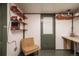 Finished basement featuring workbench with shelving and a chair, ideal for a home office or hobbies at 4467 W 30Th Ave, Denver, CO 80212